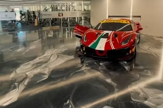 Supercar garage with completed metallic epoxy flooring